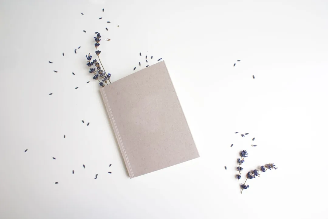 A notebook open on a calm, clean desk ready for journaling