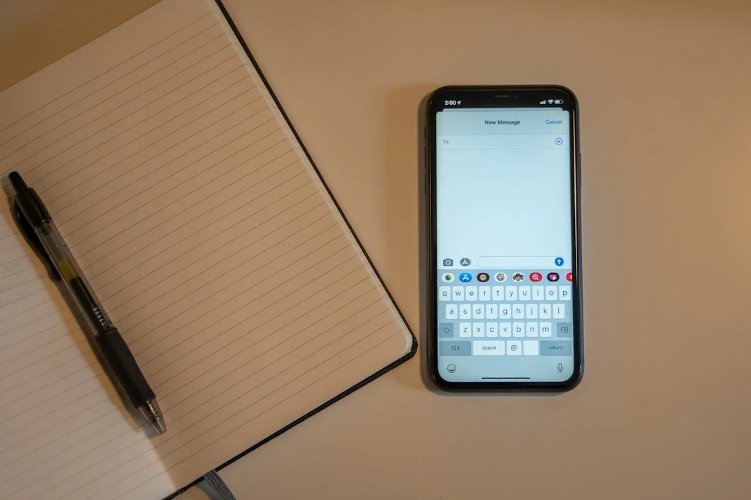 A phone showing a journaling app on a wooden desk next to a coffee cup, representing the Mindful AI daily habit