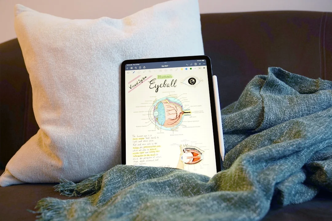 A cosy journaling setup with a warm blanket and notebook for self-compassion practice