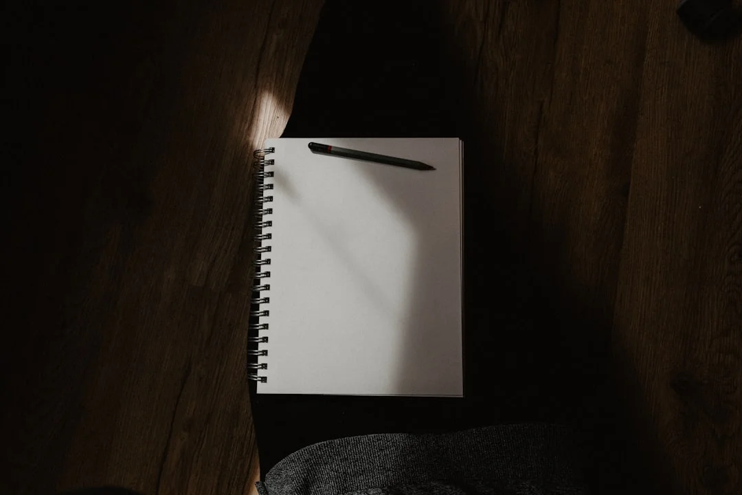 A moody journal and pen setup for deep self-reflection and shadow work